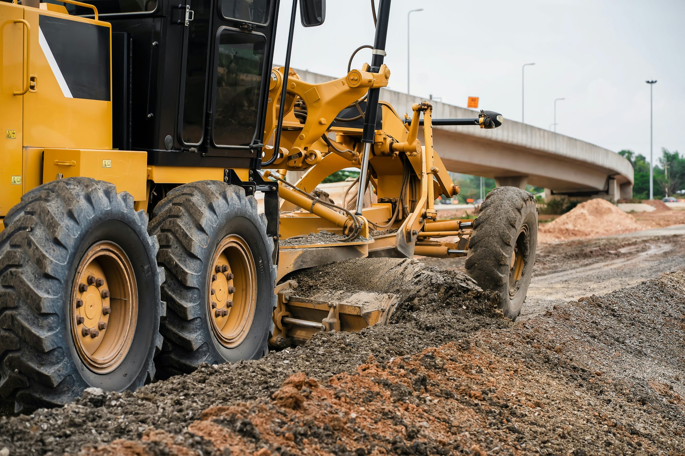 Heavy equipment grading and preparing a development site